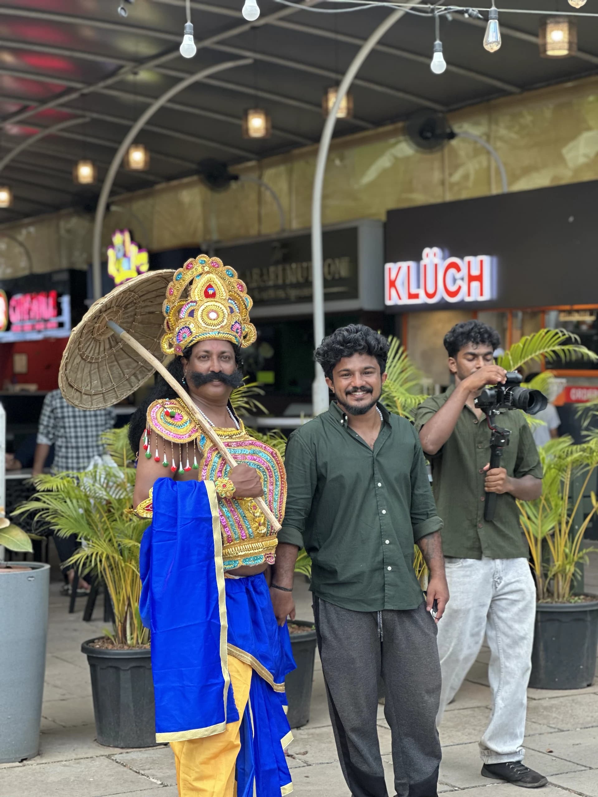Bdot team member dressed as King Mahabali for Onam at a cafe